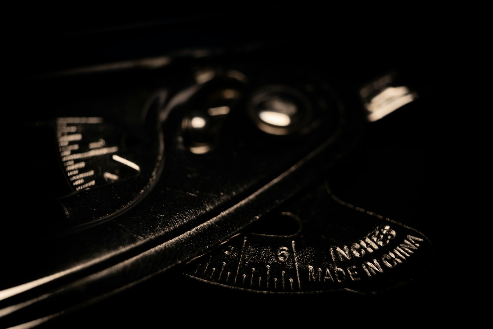 Close-up of a precision dial gauge in low light